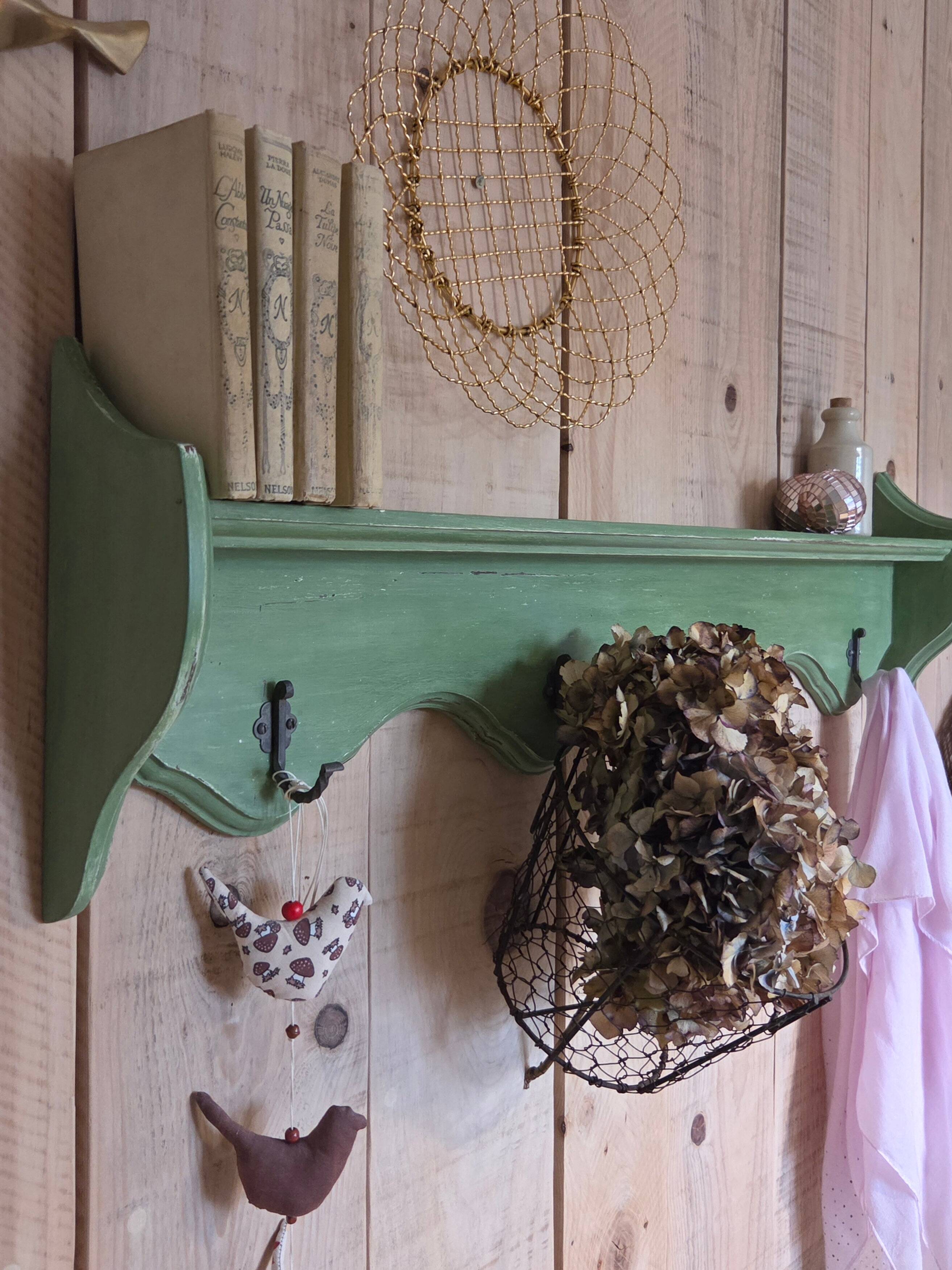 Antique wall shelf with a green patina