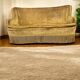 Vintage mustard yellow two-seater sofa with fringe