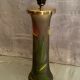 Pied de lampe en verre teinté à décor végétal émaillé