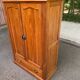 Small wardrobe / bonnetière in solid honey pine with 2 doors and 1 drawer.