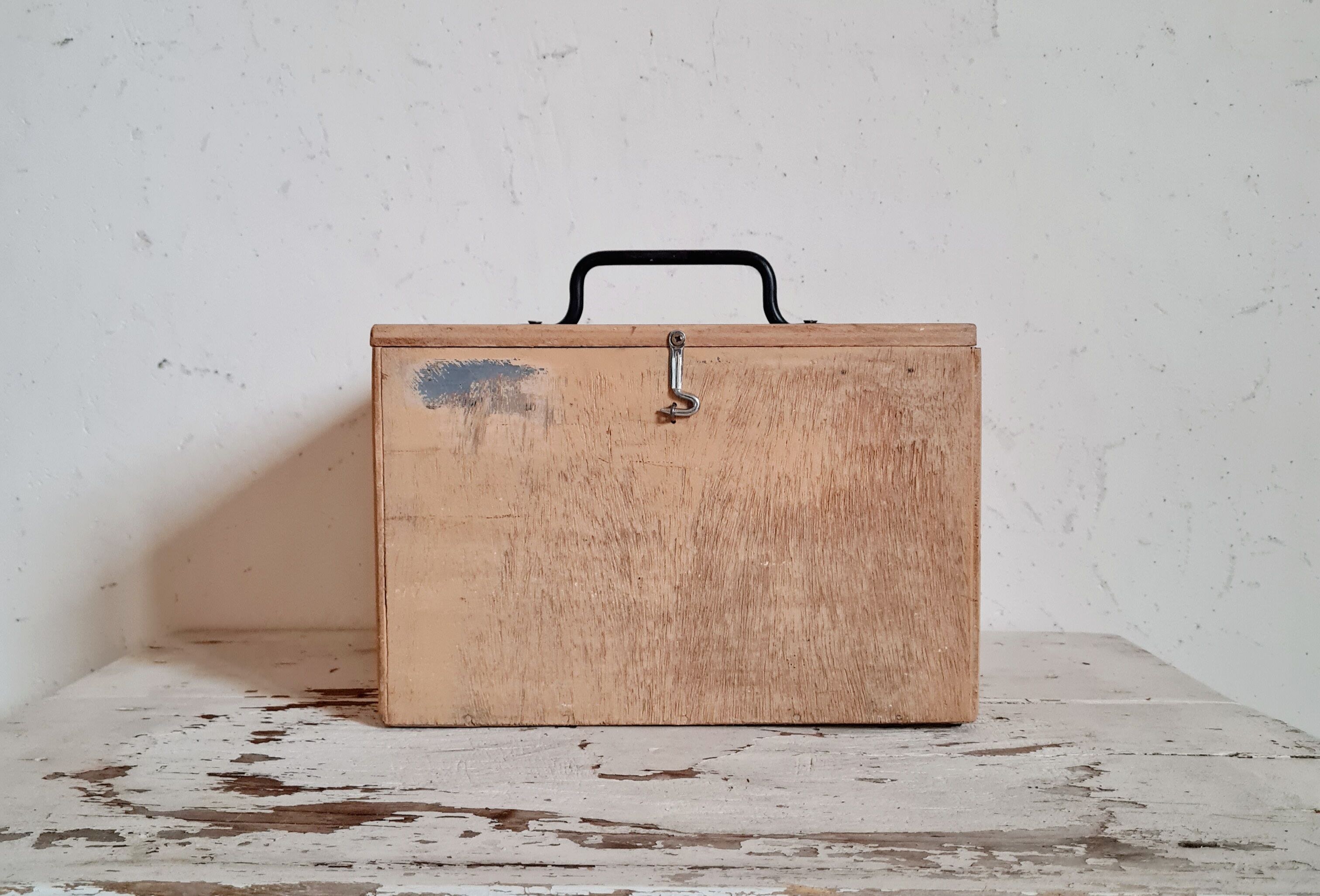 Small trunk in old wooden chest