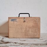 Small trunk in old wooden chest