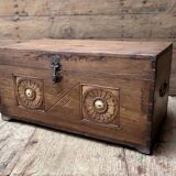Teak chest from Burma with carved rosettes.