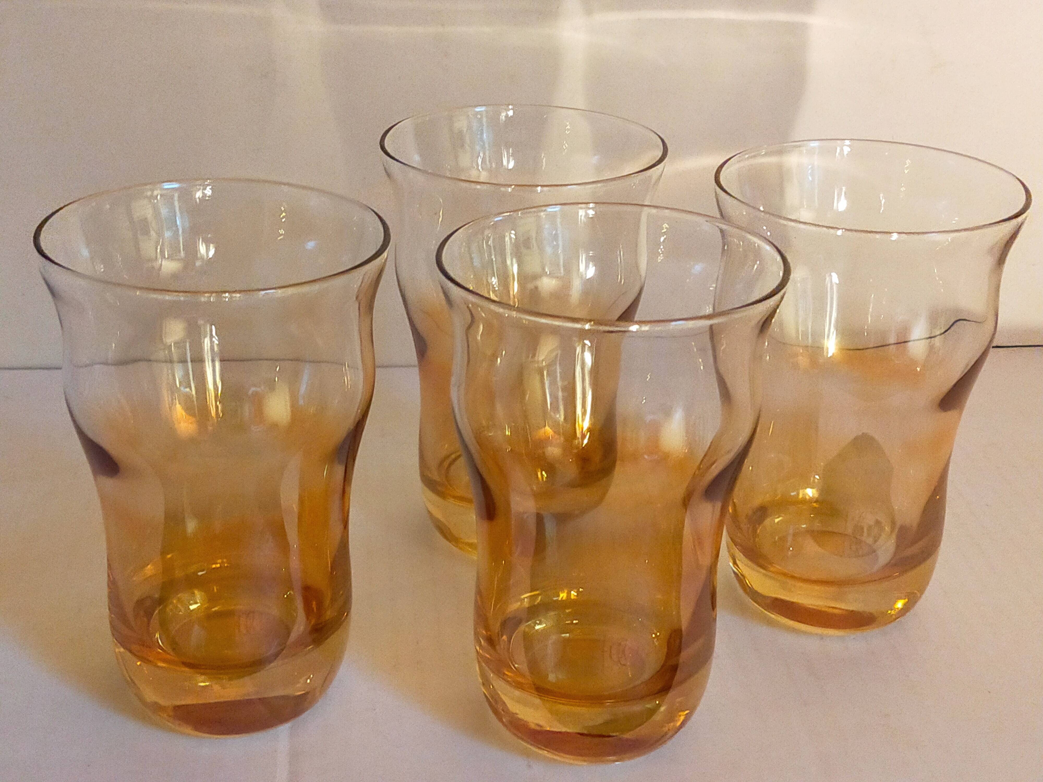 Four iridescent honey blown glass glasses