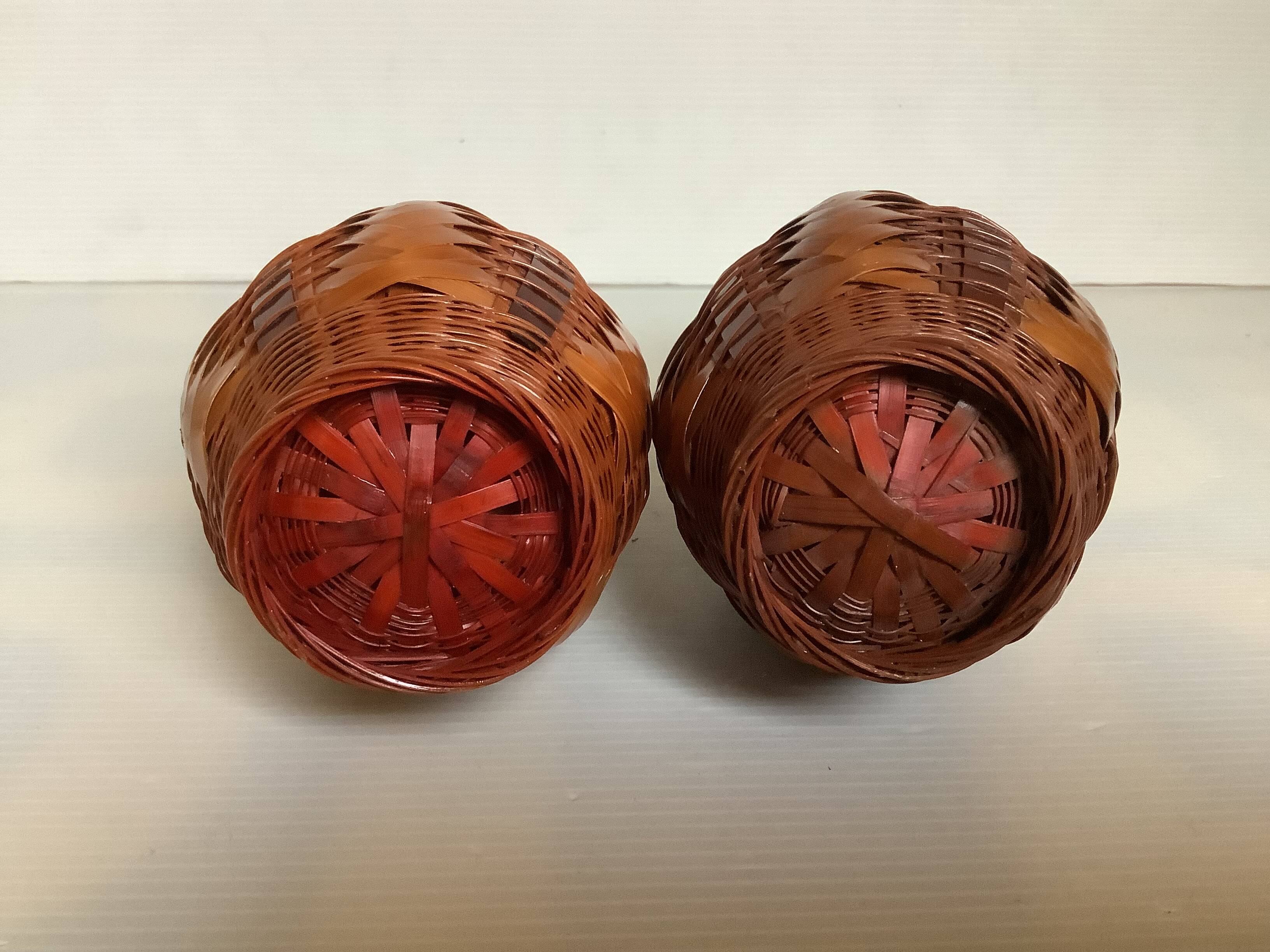 Pair of small woven vases in wicker rattan straw