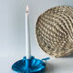 Old enamelled metal candlestick