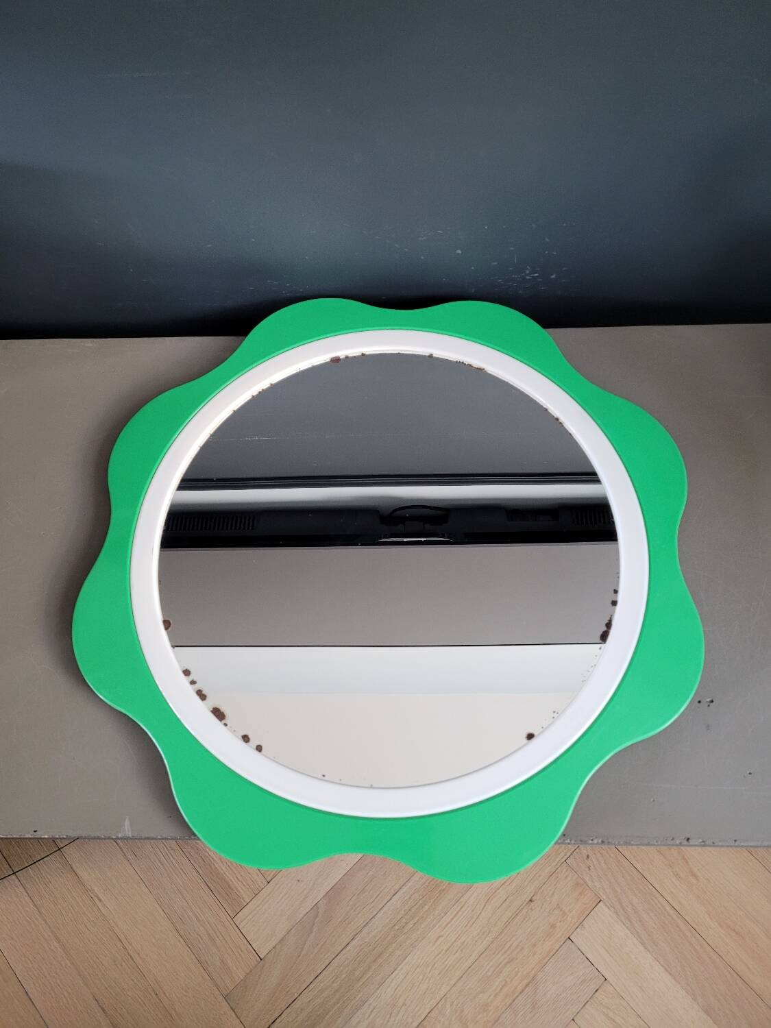 Plastic flower mirror by Finnish designer Makisen Kuvastin