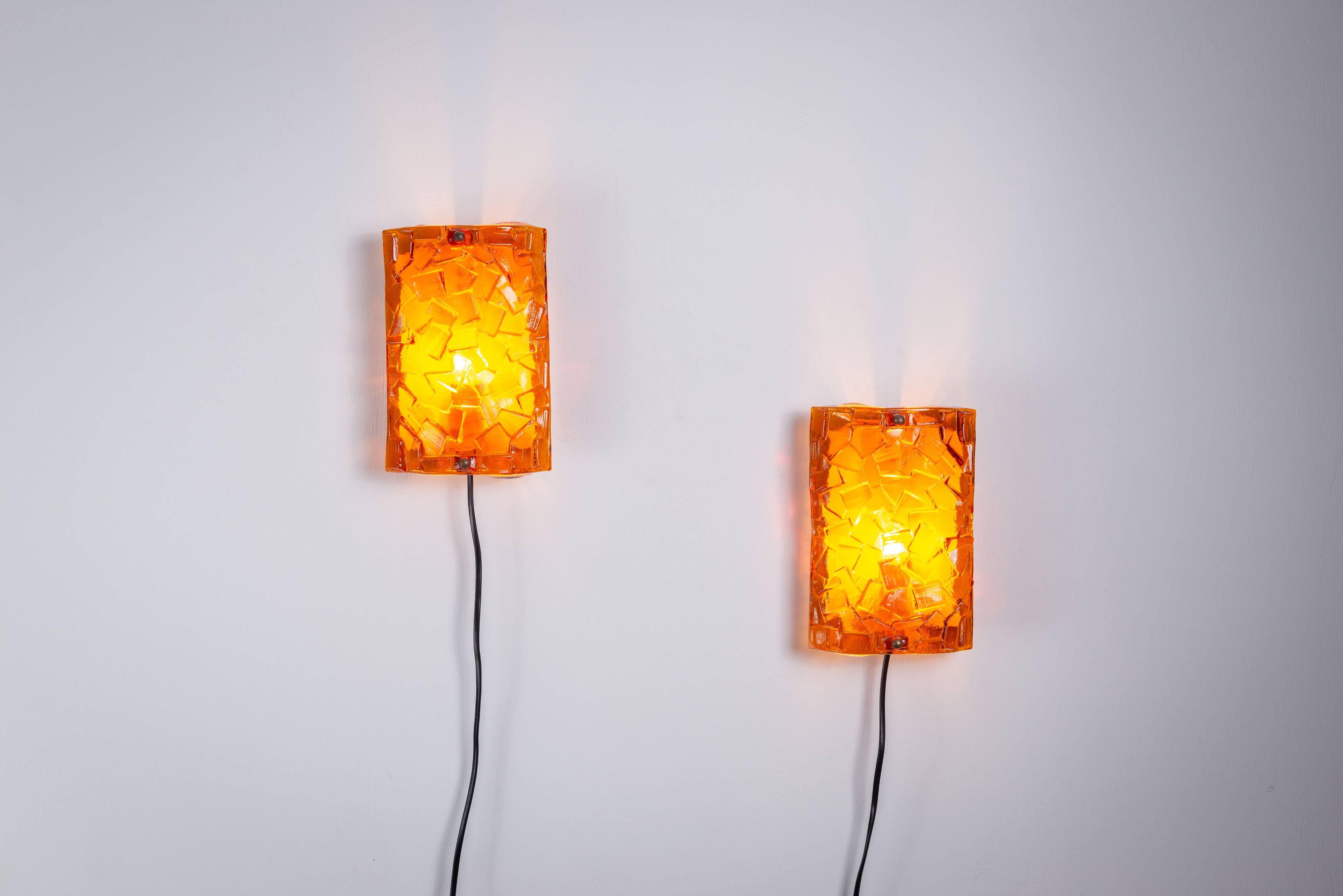Vitrika Nybro amber coloured wall lamps