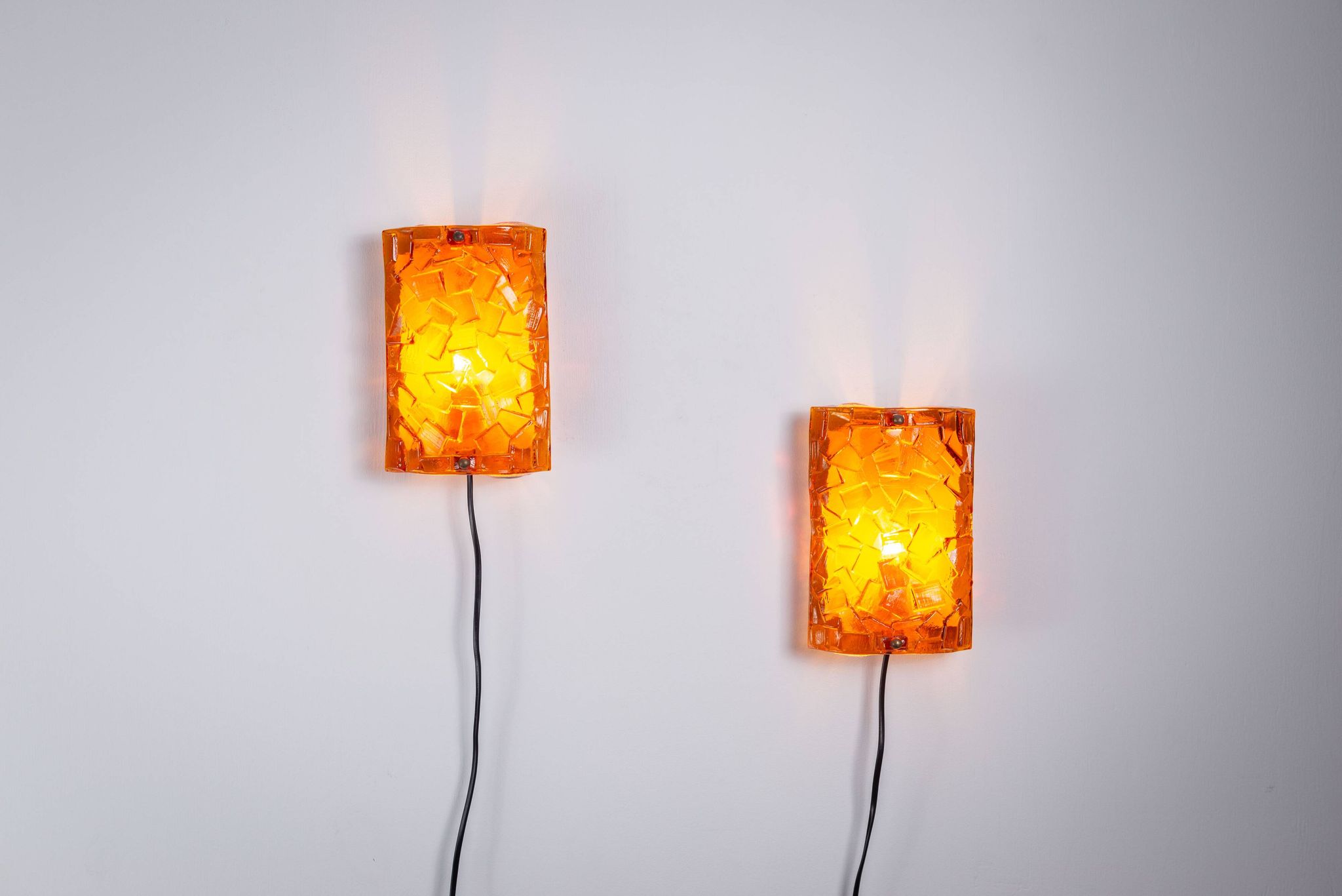 Vitrika Nybro amber coloured wall lamps