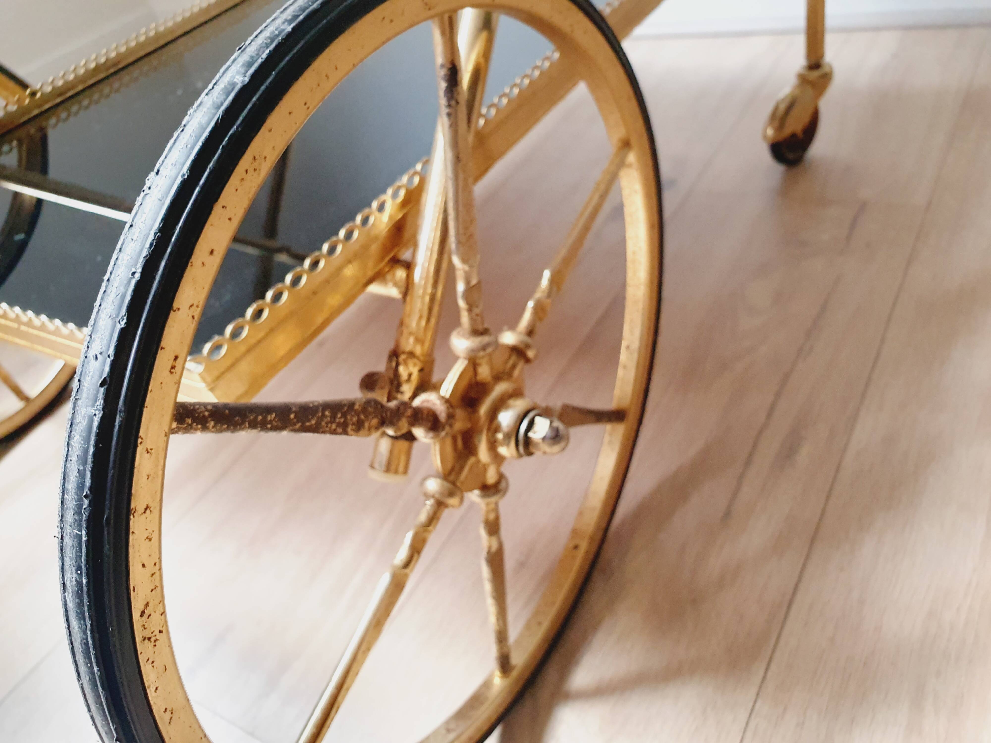 Vintage golden metal dessert on wheels