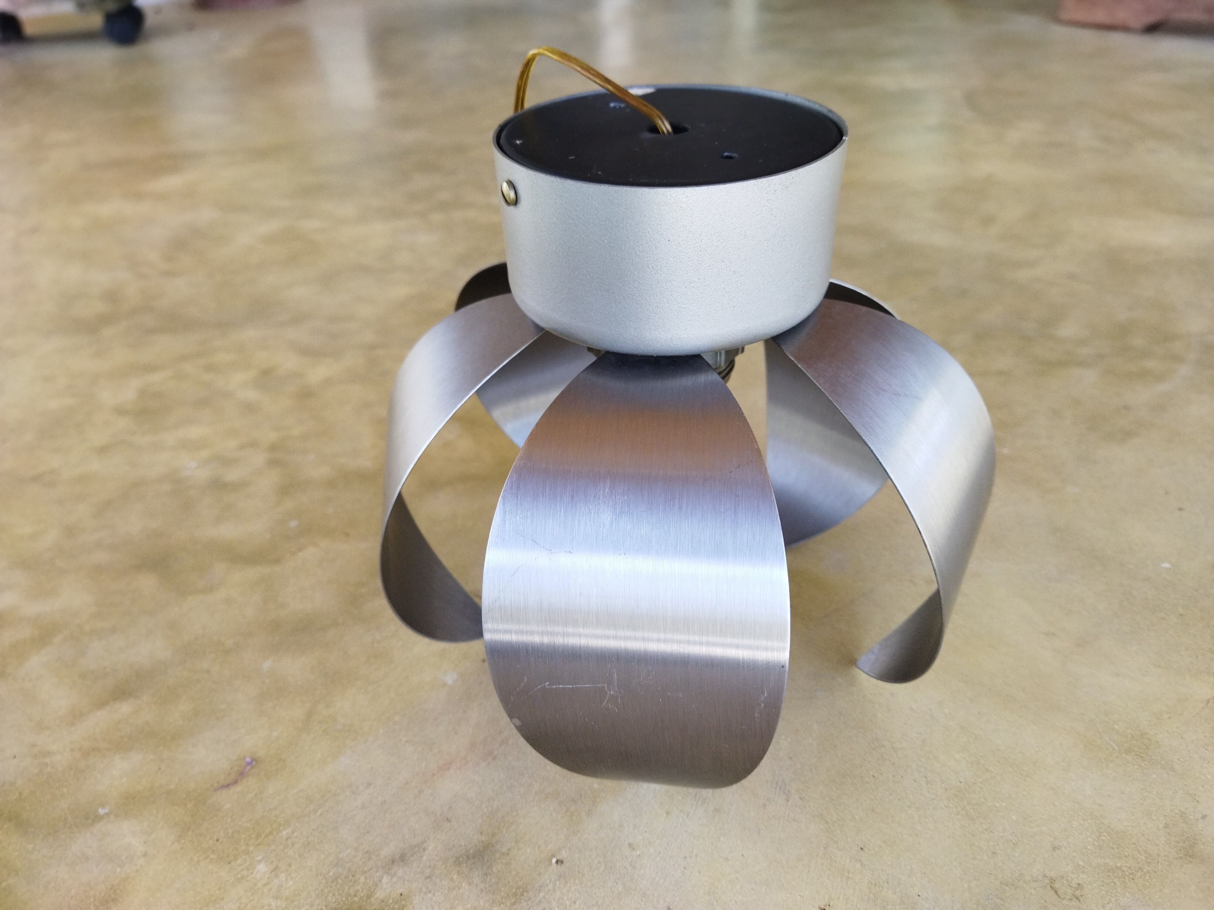 A set of brushed stainless steel flowers sconces