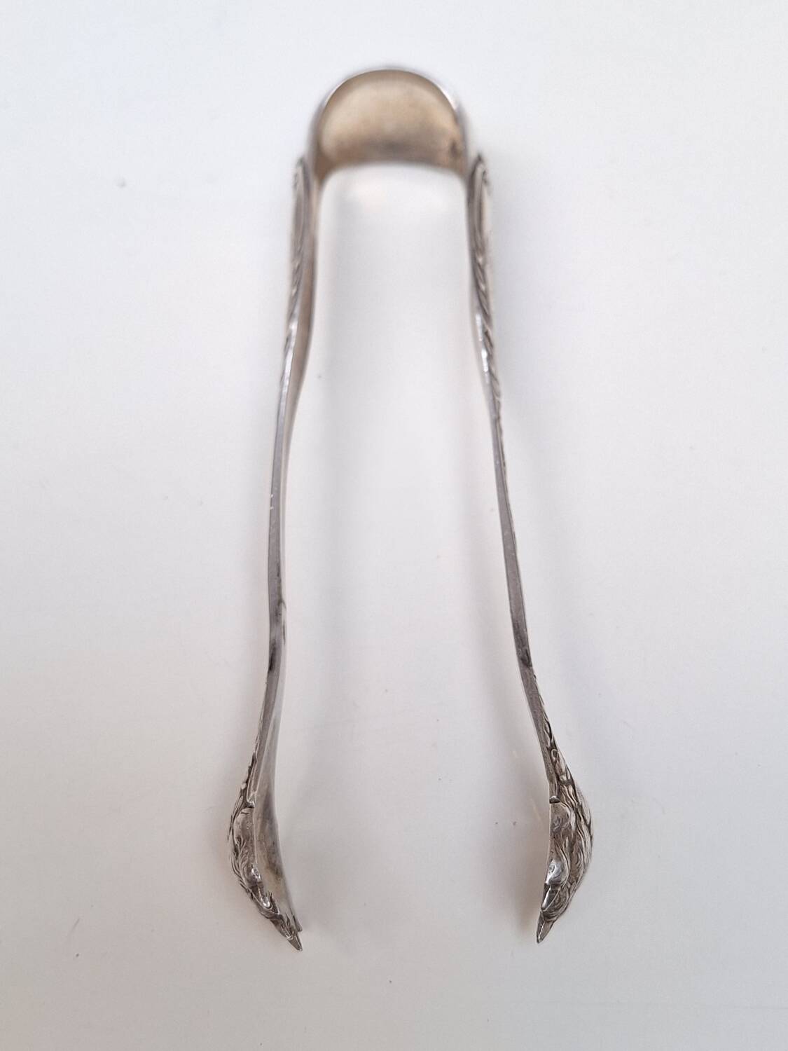 Solid silver sugar or ice tongs with lion's paw decoration