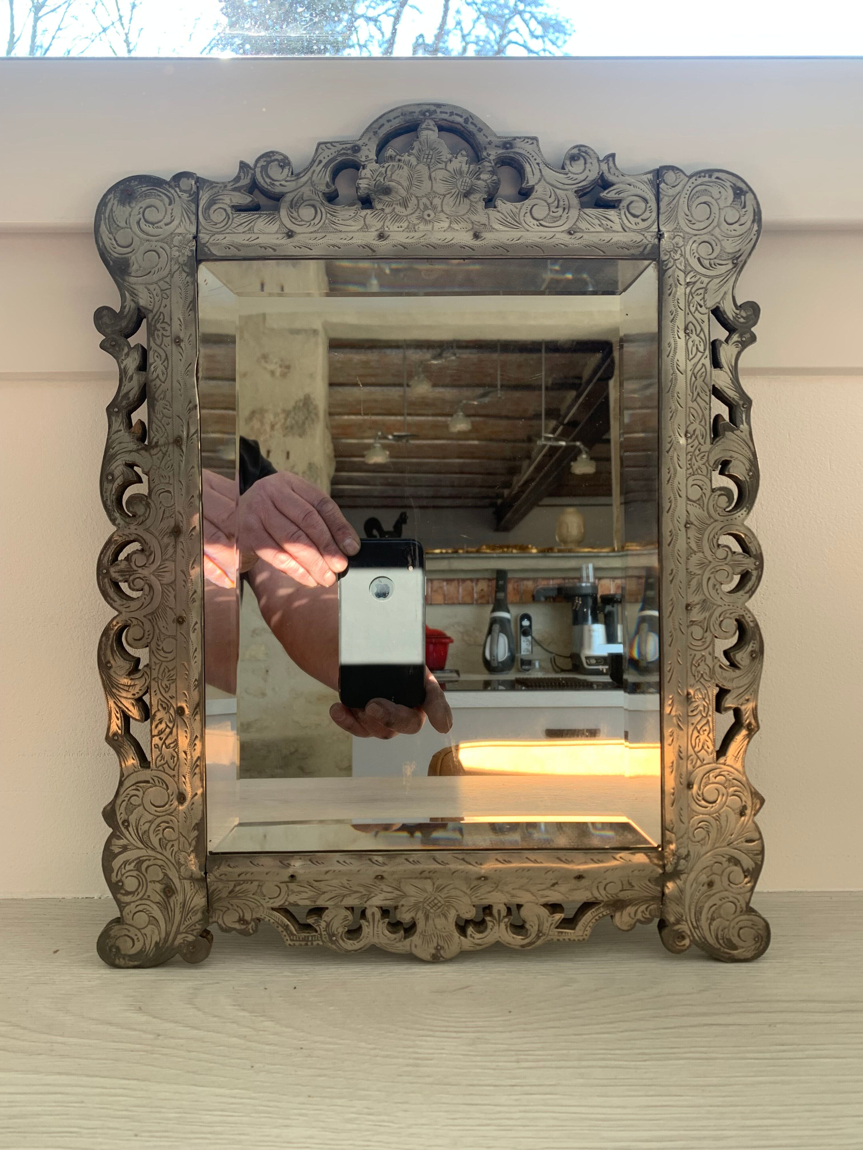 Eventful beveled mirror and openwork period 1900 repelled tin decoration