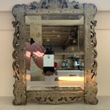 Eventful beveled mirror and openwork period 1900 repelled tin decoration