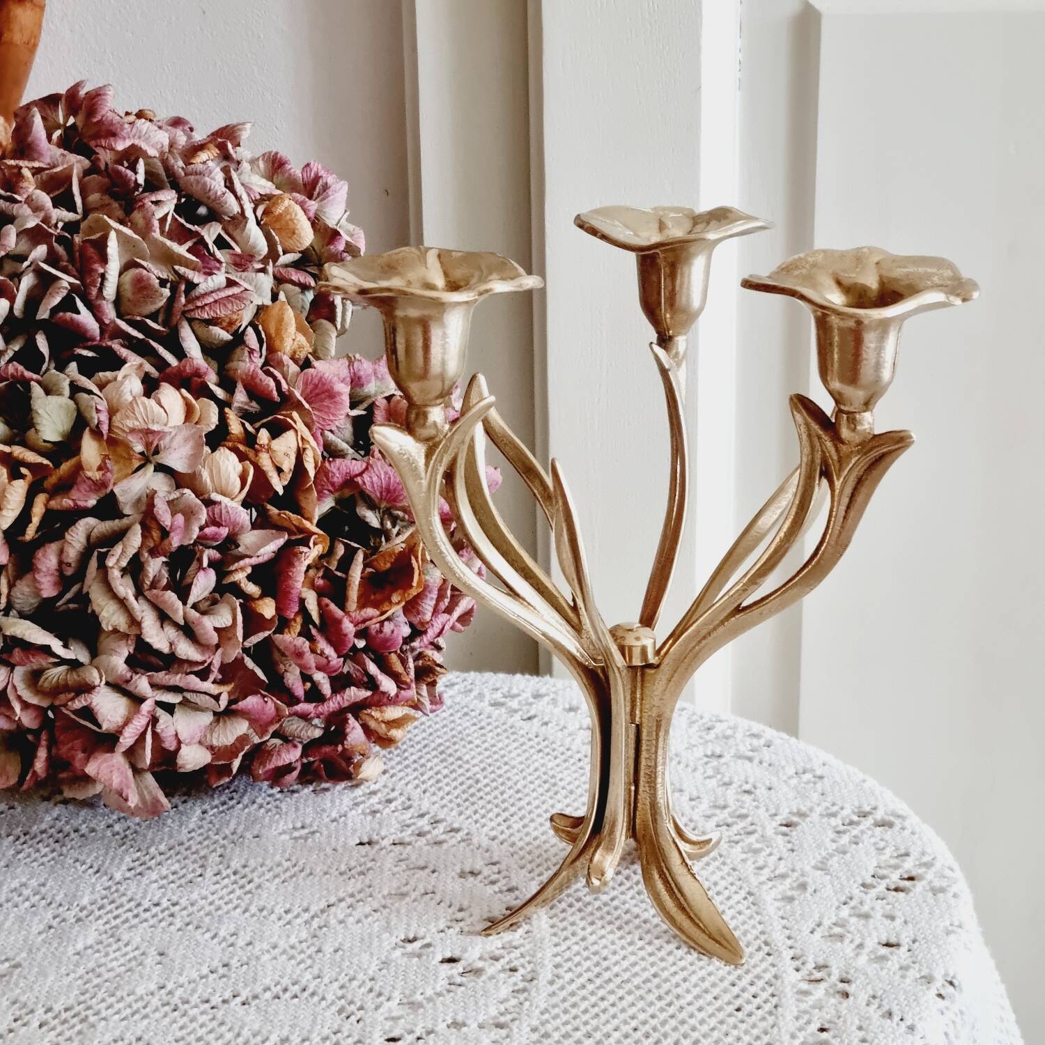 Tall brass flower candlestick
