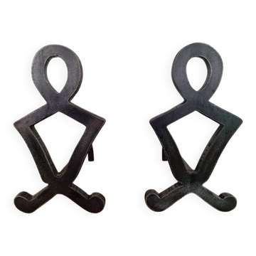 pair of wrought iron andirons by Raymond Subes