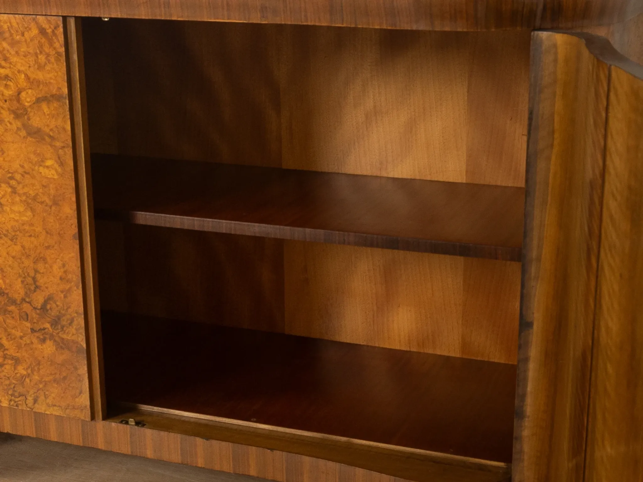 Classic two-piece Art Deco display cabinet from the 1930s with striking burl wood veneer
