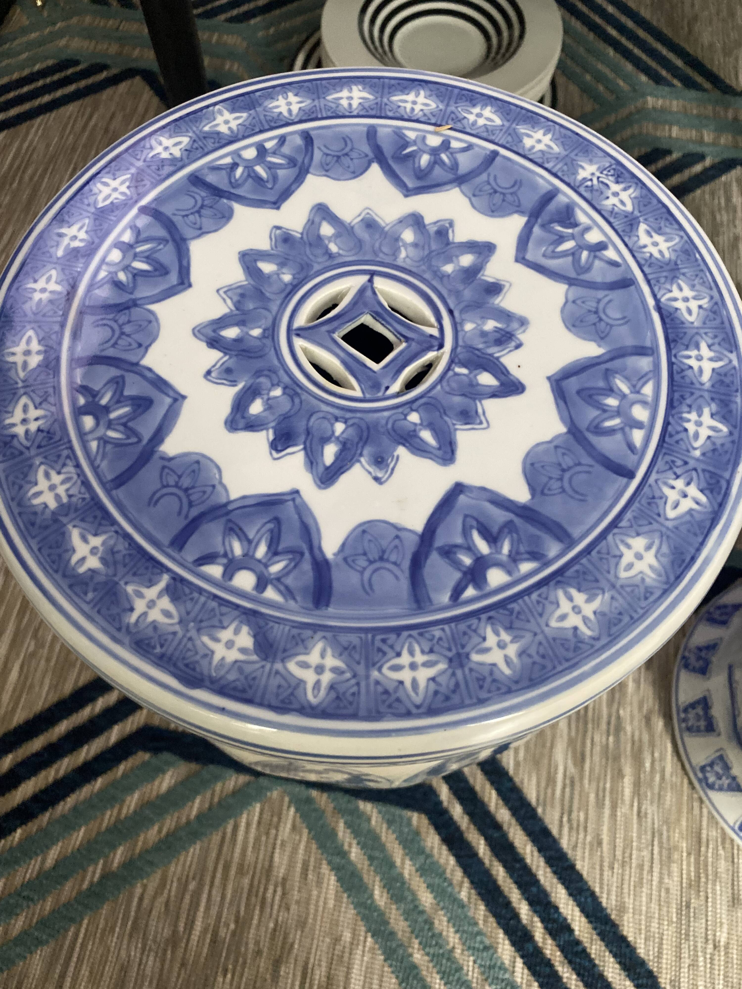 Set of two white and blue porcelain side tables.