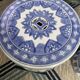 Set of two white and blue porcelain side tables.