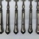 Set of 6 silver-plated oyster forks with 7 knot pattern filigree.