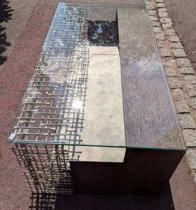 Metal coffee table with a glass top.