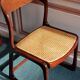 Suite de 6 chaises traineau Baumann cannées vintage