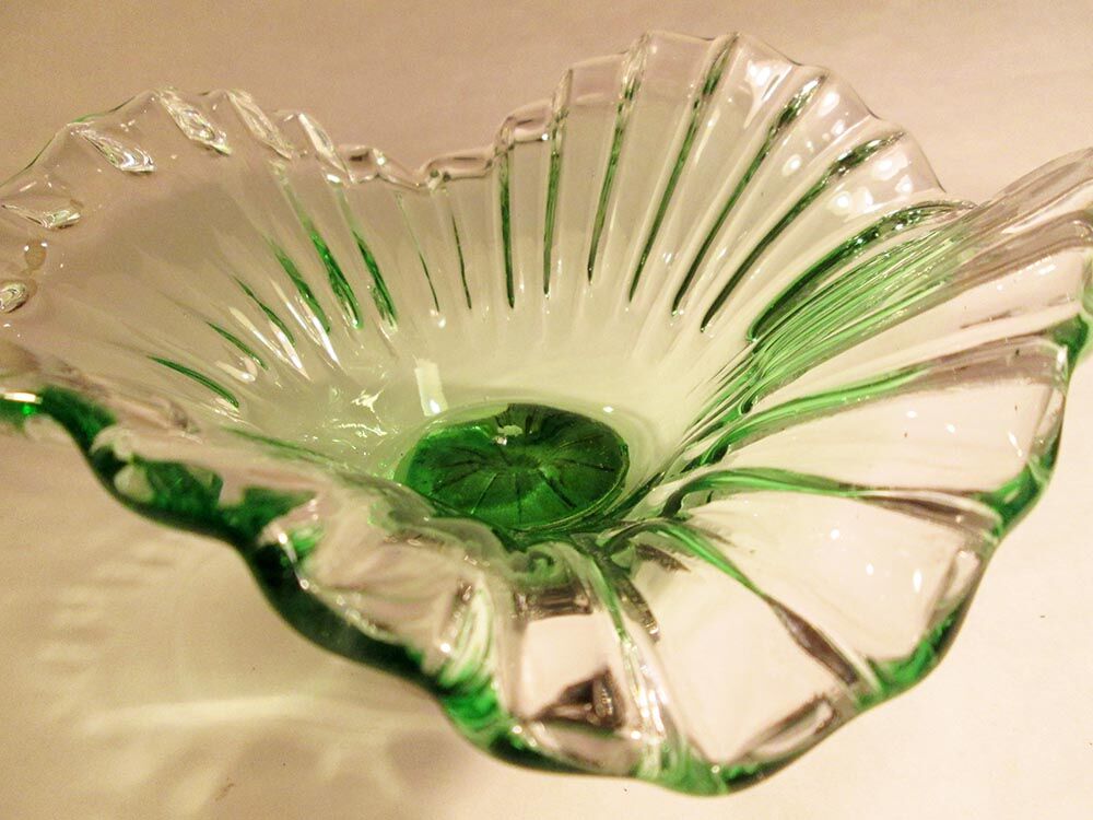 Glass cup on decorated metal stand