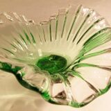 Glass cup on decorated metal stand