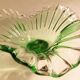 Glass cup on decorated metal stand