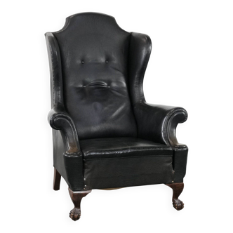Antique black English cow leather wingback armchair from the 19th century
