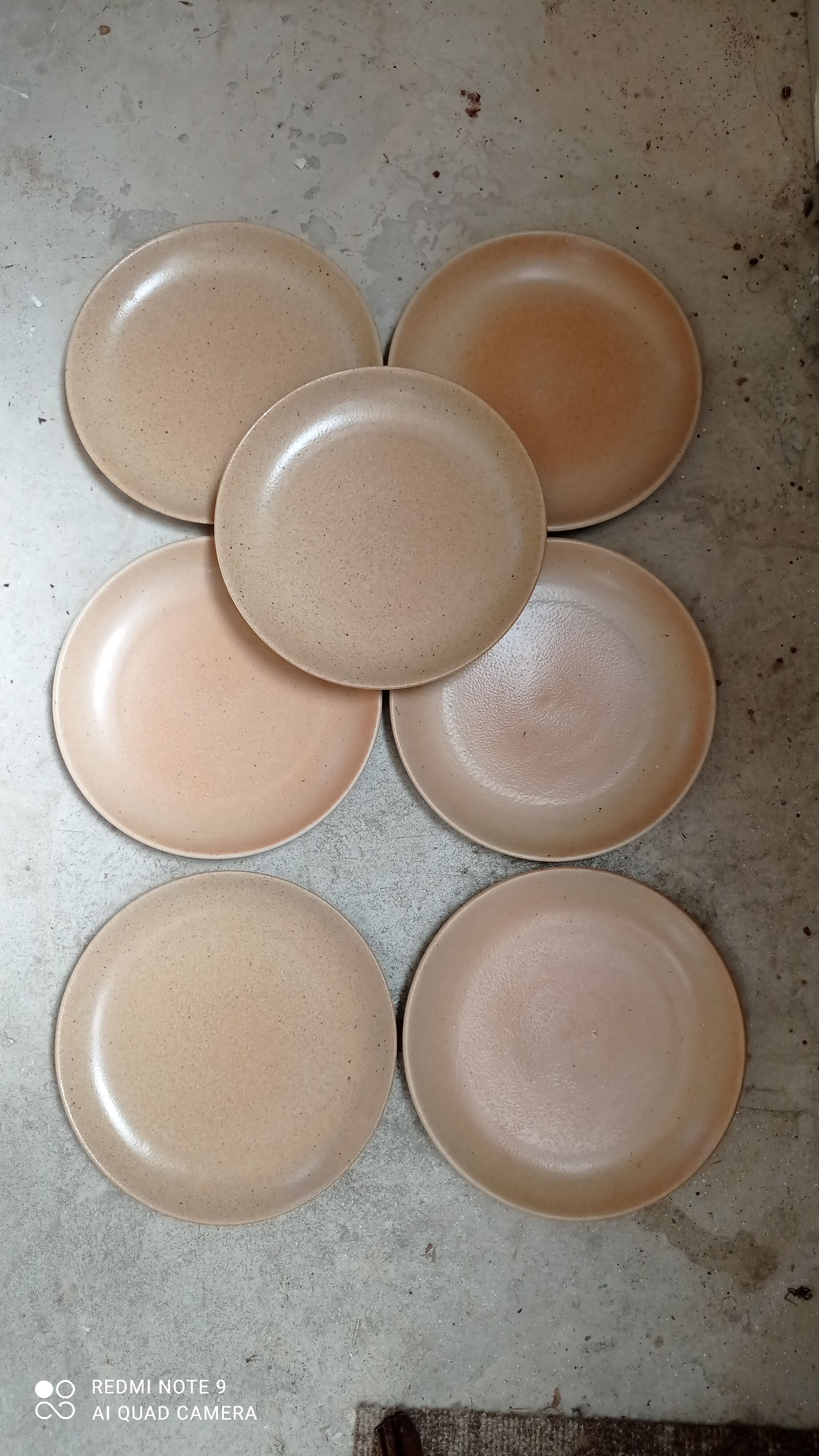 Set of seven plates in sandstone
