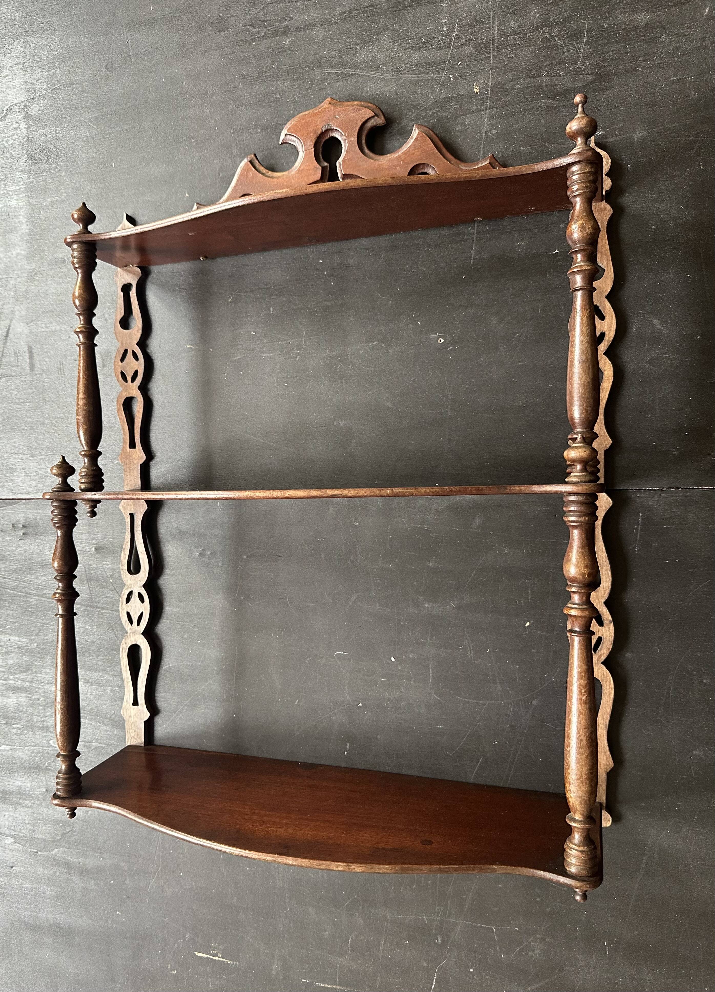 Napoleon III wall shelf in turned wood with a pediment.