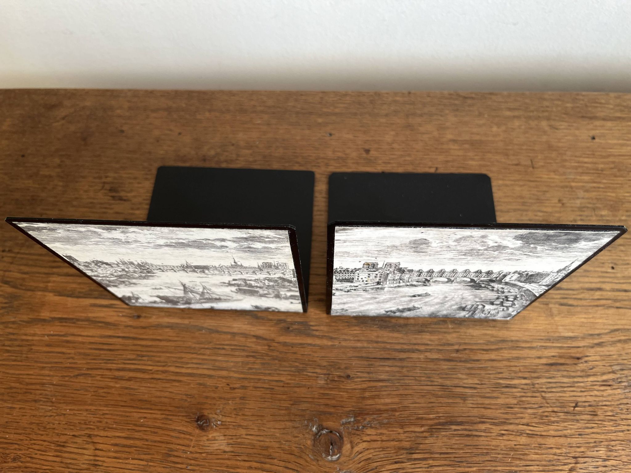 Bookends 1960 between Fornasetti's grey and Toile de Jouy views of Paris.