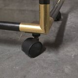 Black metal and brass rolling dessert trolley, smoked glass, 1970s.