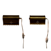 A pair of charming wall sconces/branches in brass with a star pattern, modern Scandinavian style.
