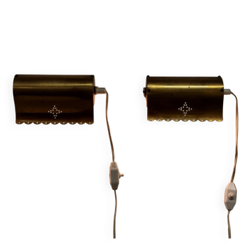 A pair of charming wall sconces/branches in brass with a star pattern, modern Scandinavian style.