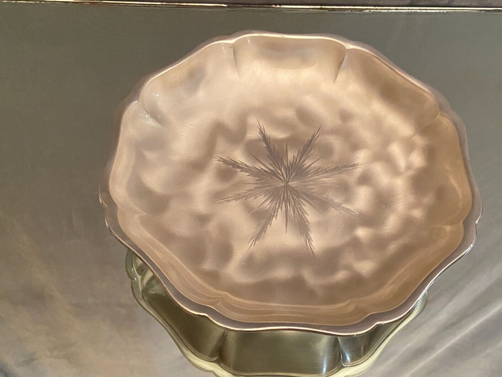 Metal dish with starry decoration