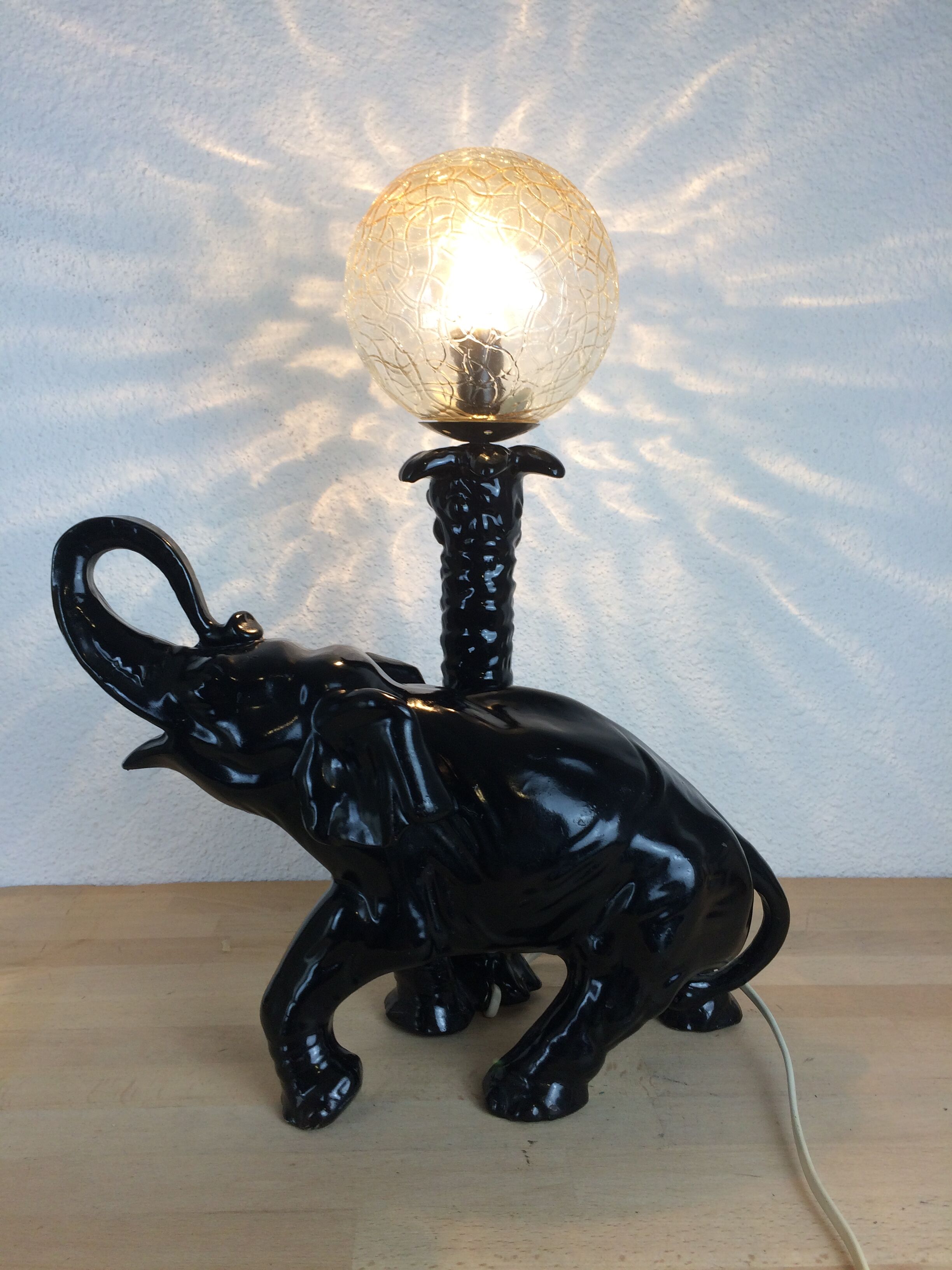 Elephant lamp and palm tree in black resin