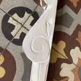 White patinated wooden pediment.