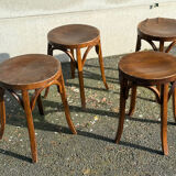 Set of four curved wooden stools stamped Baumann model 92.