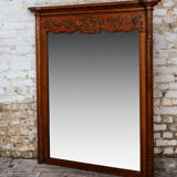Beveled mirror in carved oak early twentieth century