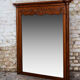 Miroir biseauté en chêne sculpté début XXème