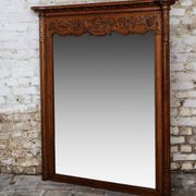 Miroir biseauté en chêne sculpté début XXème