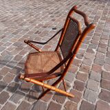 Bamboo folding chair and caning, leather and brass