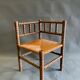 Chaise d’angle en bois et paille années 50