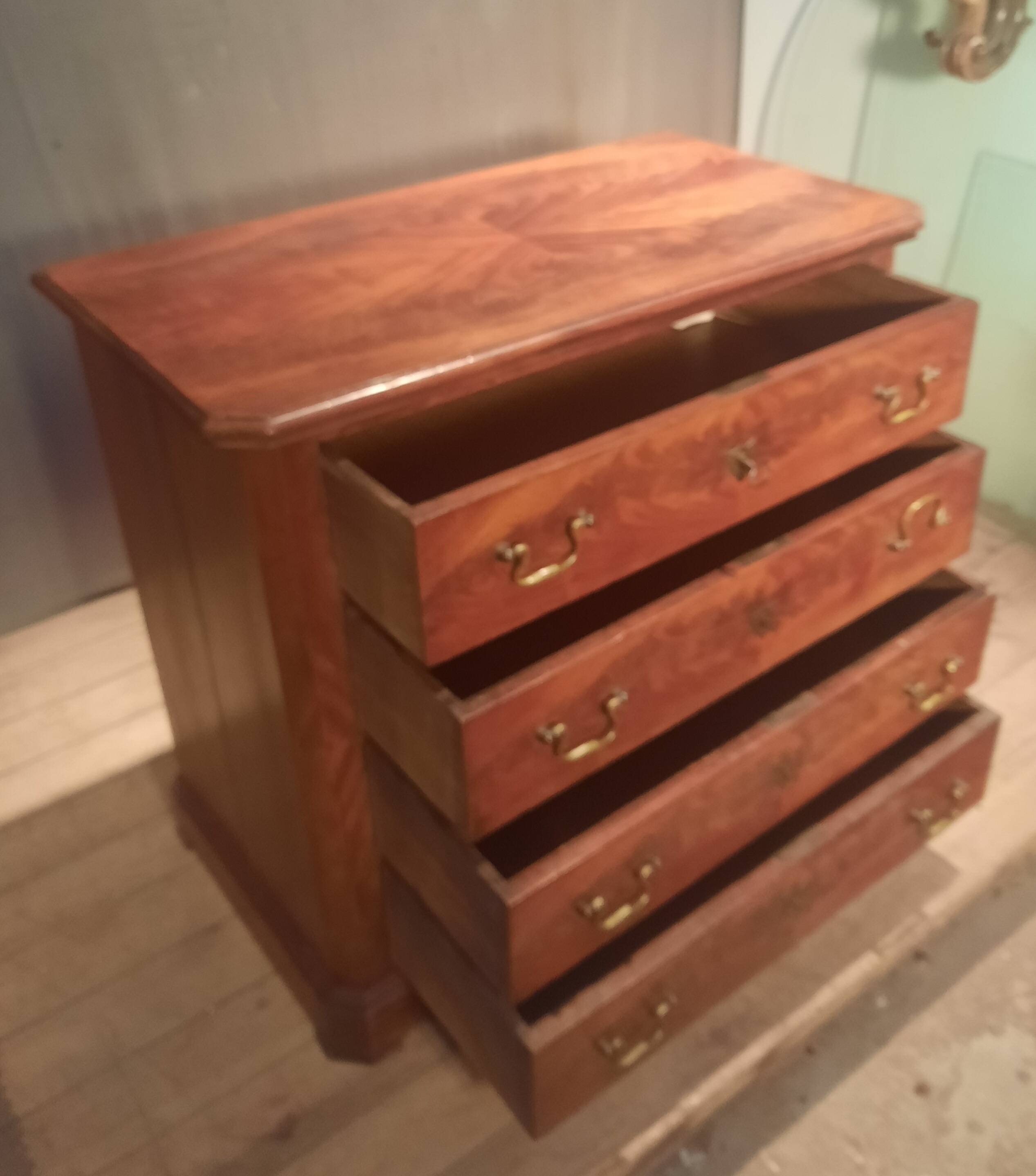 Small Louis Philippe chest of drawers with cut corners.