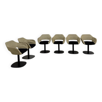 Series of six swivel chairs with an organic shell, patterned fabric and base.