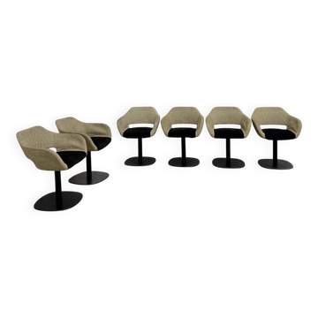 Series of six swivel chairs with an organic shell, patterned fabric and base.