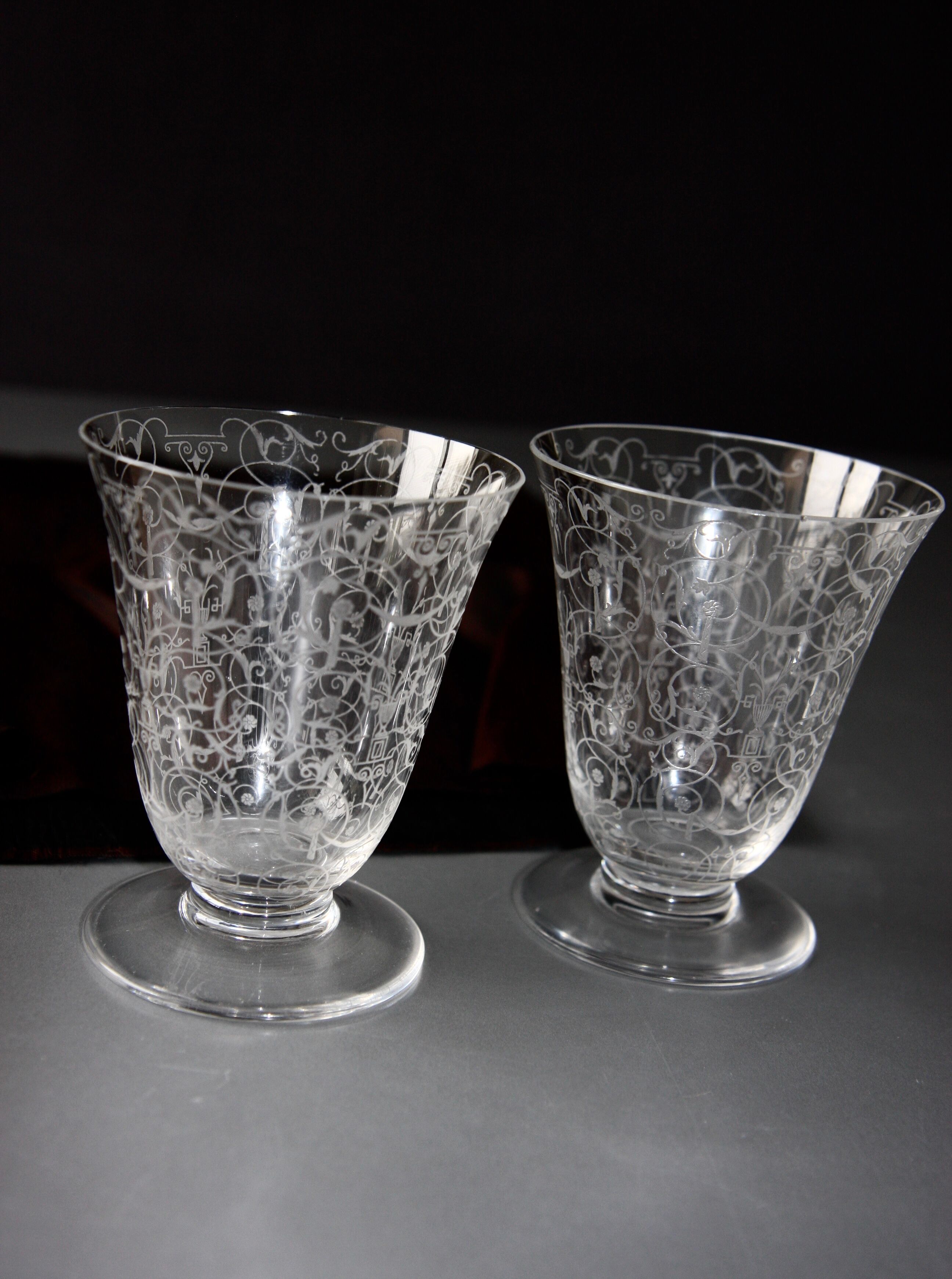 Two Baccarat glasses model "Michelangelo" in engraved crystal.
