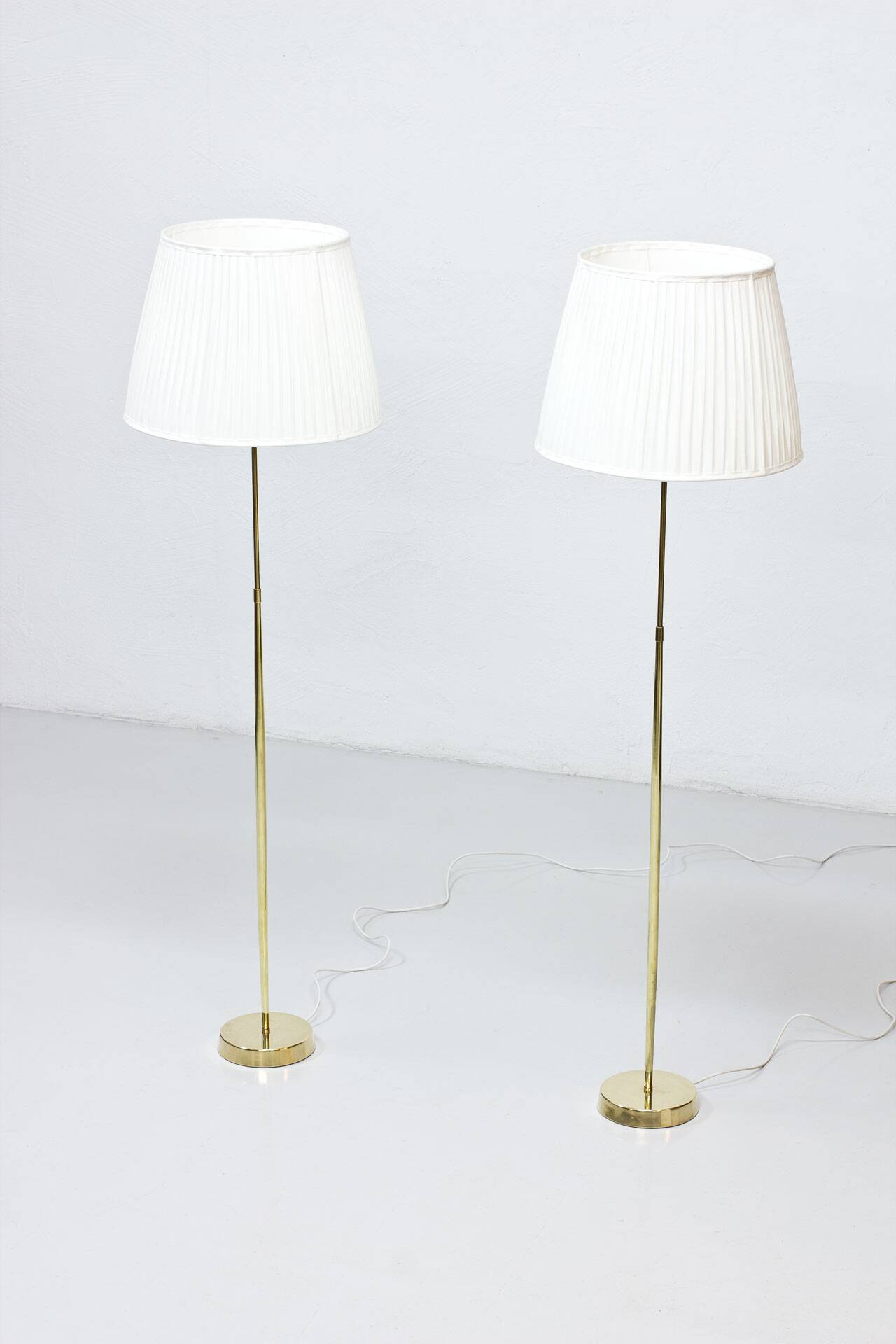 Pair of brass floor lamps by ASEA Belysning, Sweden, 1950s